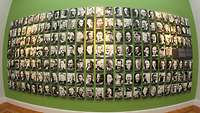 Several black-and-white pictures on a wall of resisters to the Nazis