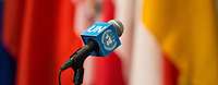 Microphone with UN logo and International flags
