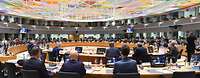 Der Saal für das Ministertreffen, verschiedene Personen sind sitzend von hinten zu sehen.