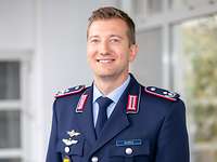 Florian Scholz looks into the camera.